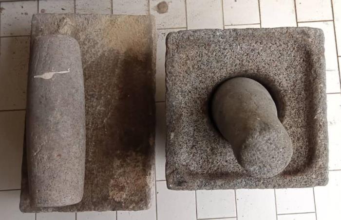 Mdm Nirmala’s mortar and pestle (right), and grinder and pestle (left) gifted to her by her late mother-in-law Mdm Dhashayani.
